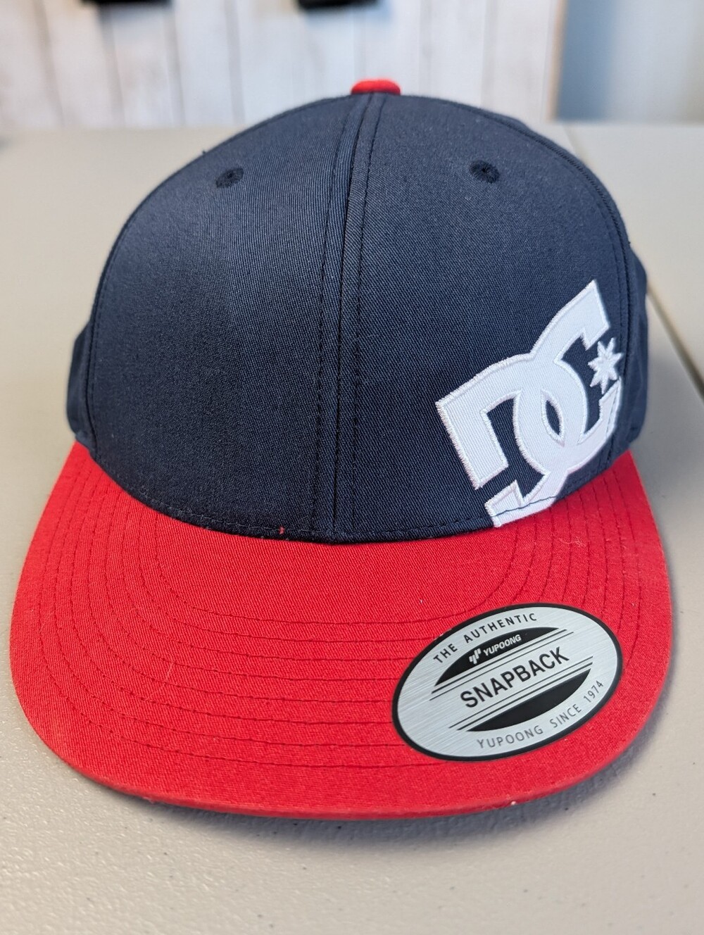 DC Two-Tone Snapback Hat in Navy and Red